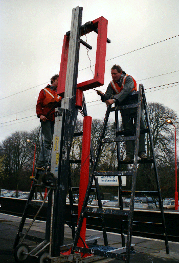 using a crane on a railway platform